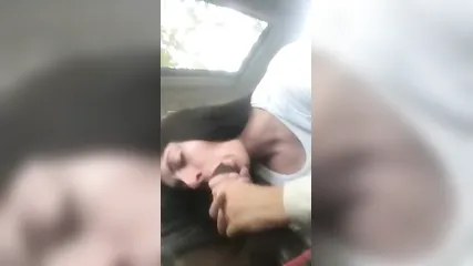 Возбужденная белая шлюха в одежде дрочит двумя руками хуй и делает негру глубокий минет